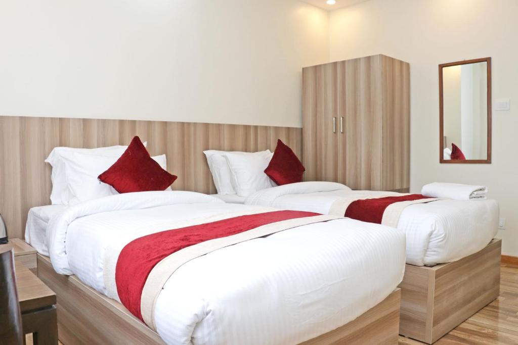 Postel nebo postele na pokoji v ubytování Hotel Royal Emperor