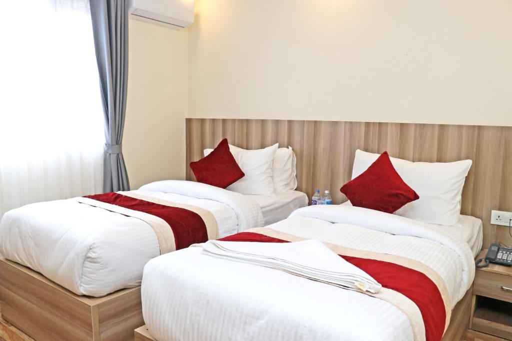 Postel nebo postele na pokoji v ubytování Hotel Royal Emperor