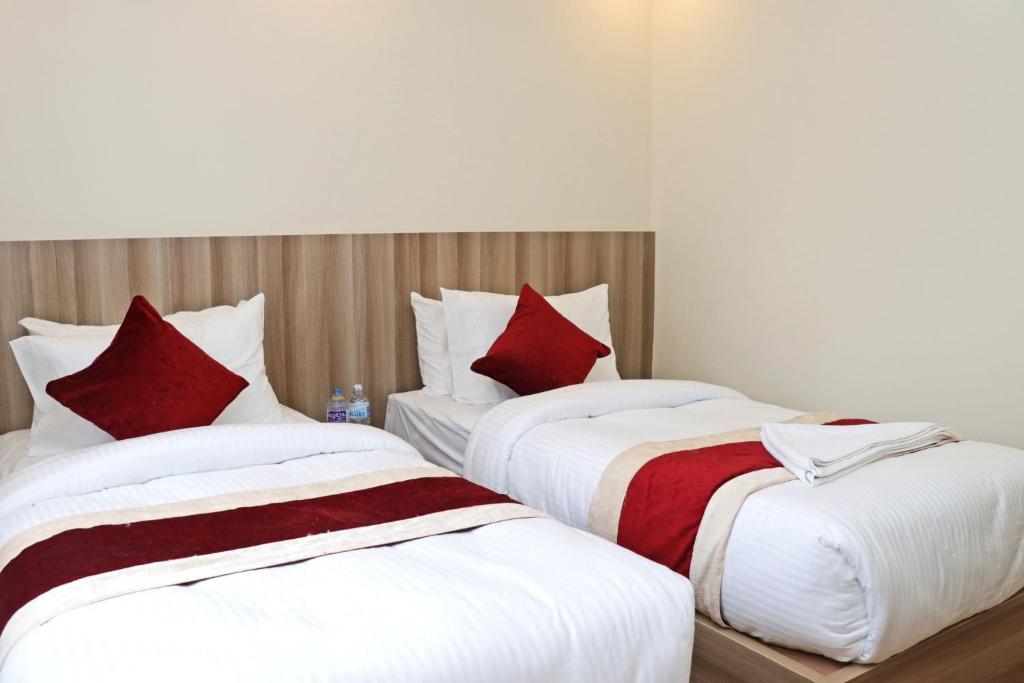 Postel nebo postele na pokoji v ubytování Hotel Royal Emperor