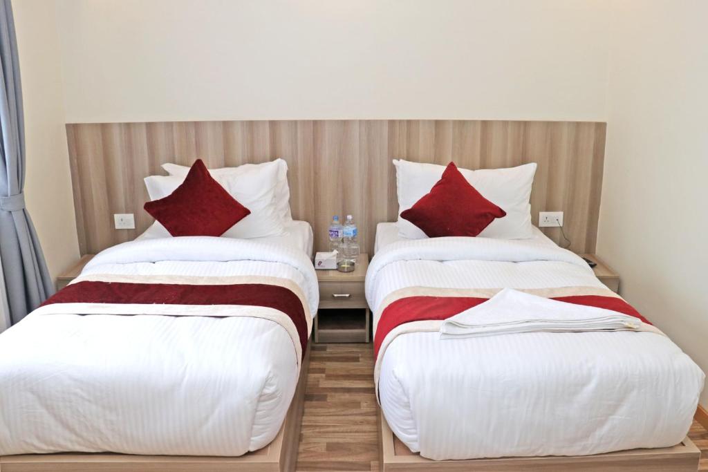 Postel nebo postele na pokoji v ubytování Hotel Royal Emperor