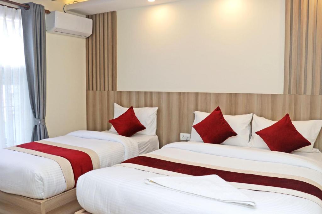 Postel nebo postele na pokoji v ubytování Hotel Royal Emperor