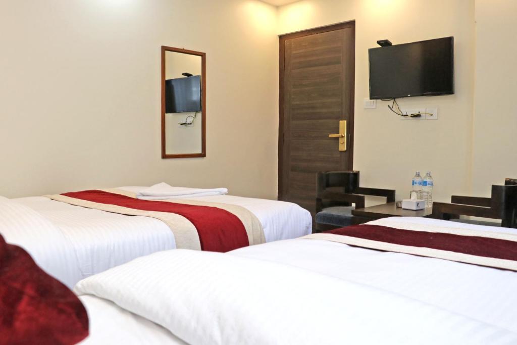 Postel nebo postele na pokoji v ubytování Hotel Royal Emperor