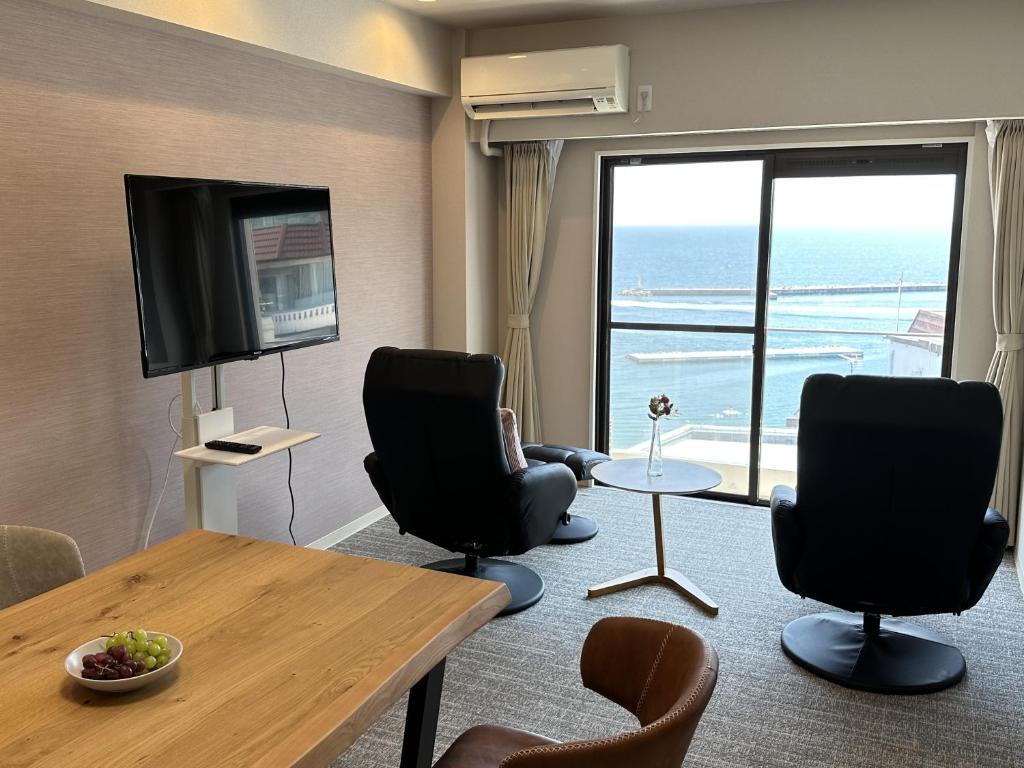 TV a/nebo společenská místnost v ubytování Grandview Atami Private Hot Spring Condominium Hotel