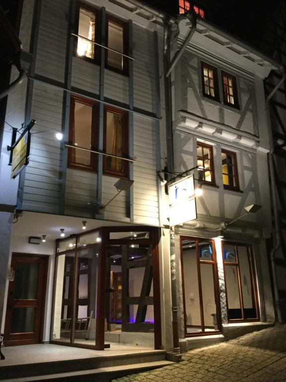 a large white building with windows at night at Ferienwohnung Kleine Rütsche in Limburg an der Lahn