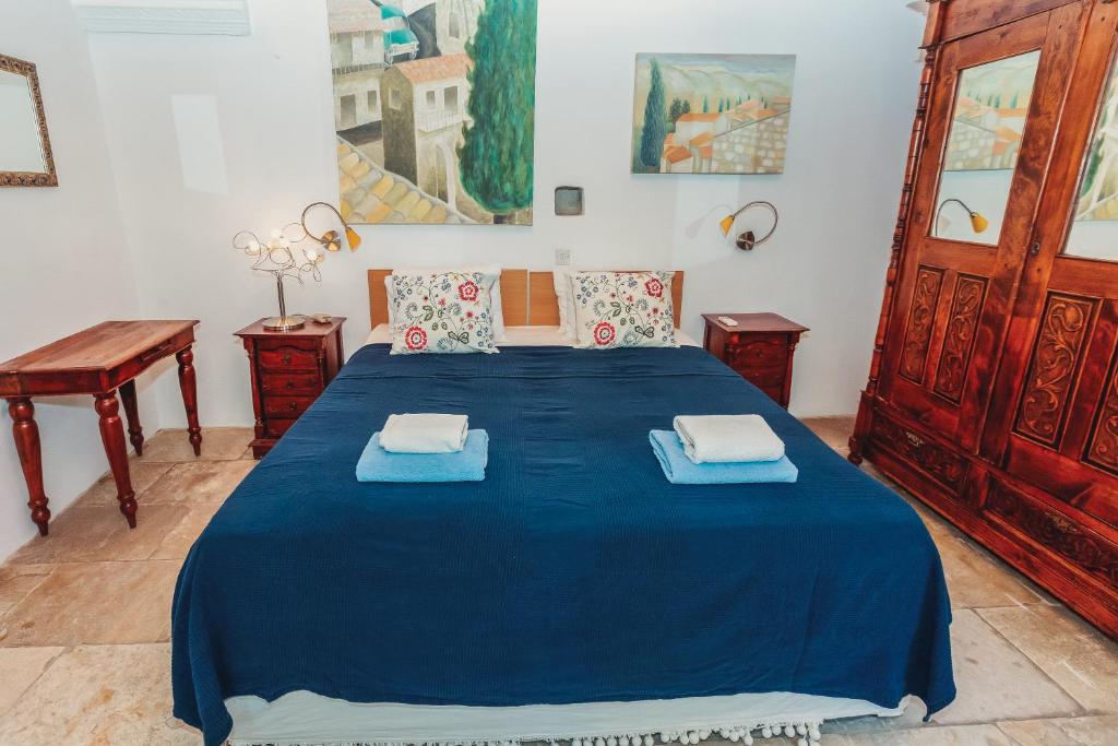 Postel nebo postele na pokoji v ubytování Archondia House - Holiday Apartments With Pool