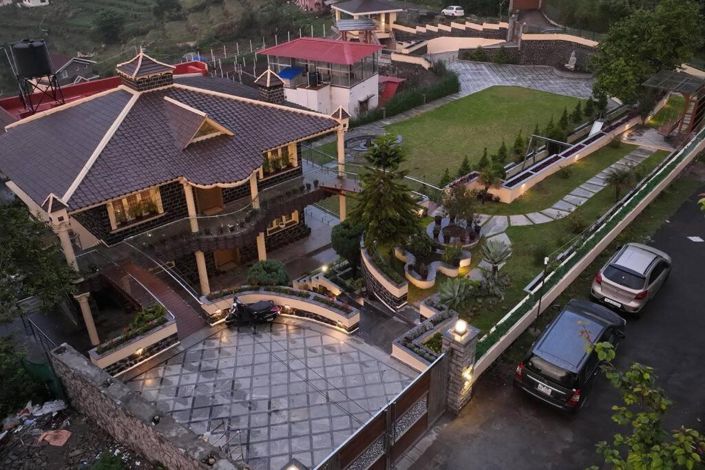 an overhead view of a house with two cars parked in a parking lot at Le Mistral, Kodai - Luxury Villa in Kodaikānāl