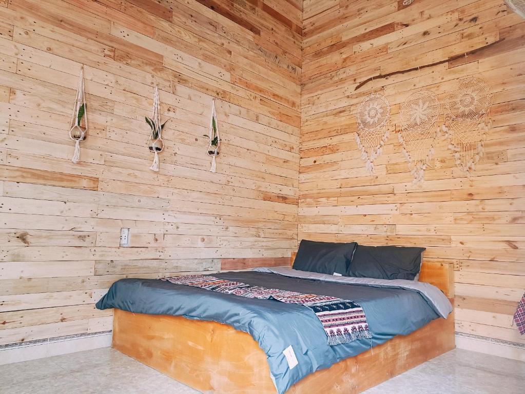 Postel nebo postele na pokoji v ubytování Mộc House