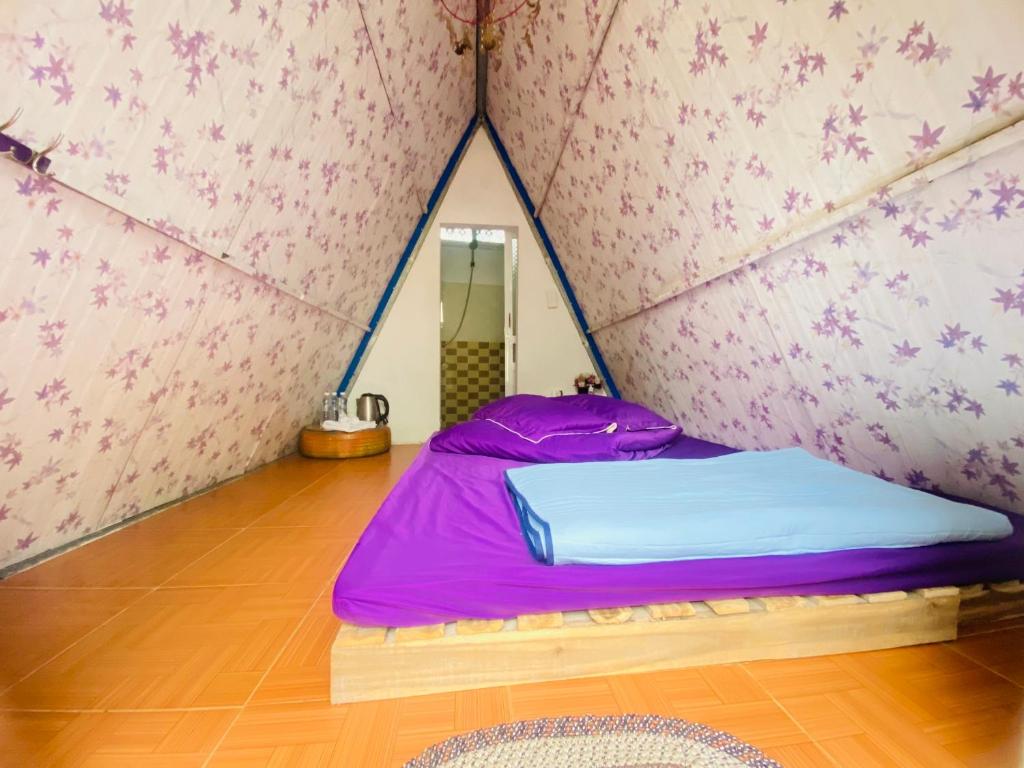 Postel nebo postele na pokoji v ubytování Mộc House