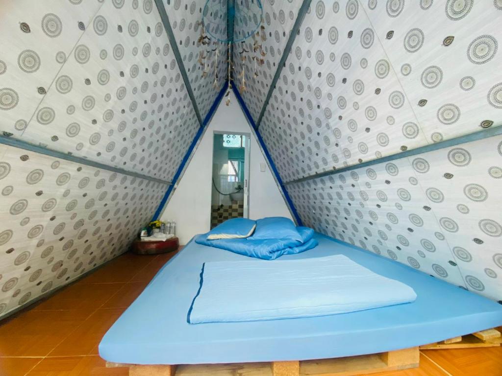 Postel nebo postele na pokoji v ubytování Mộc House