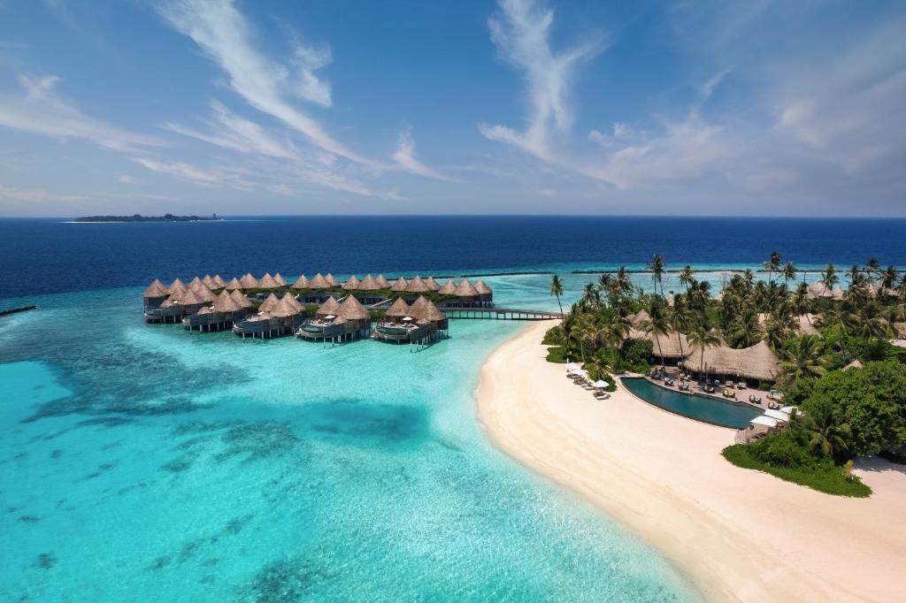 an aerial view of a resort in the ocean at The Nautilus Maldives in Baa Atoll