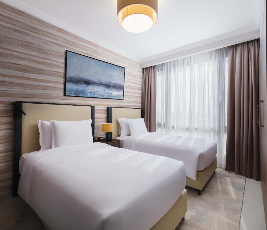 Postel nebo postele na pokoji v ubytování DoubleTree by Hilton Muscat Qurum