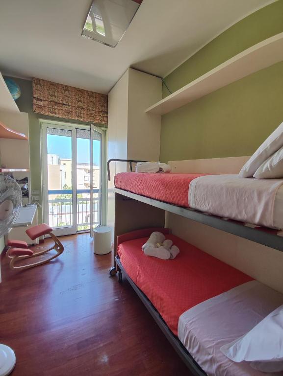 Łóżko lub łóżka w pokoju w obiekcie Casa vacanza "IL GIRASOLE"