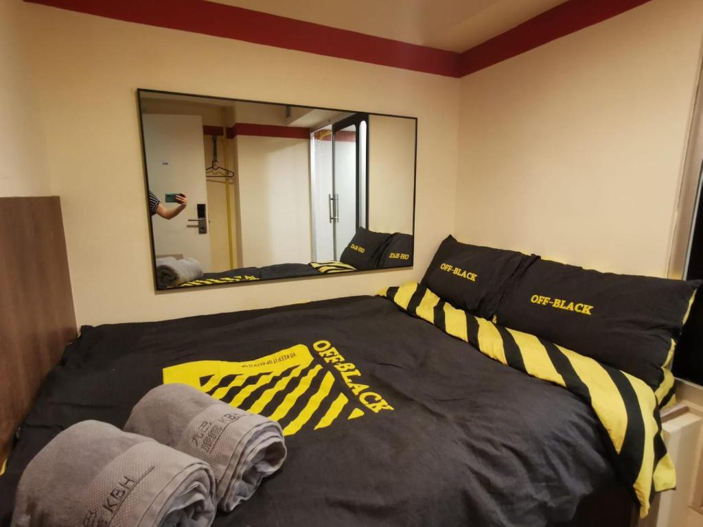 Postel nebo postele na pokoji v ubytování 香港九巴旅馆 KMB-Guesthouse