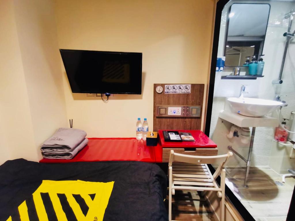 TV a/nebo společenská místnost v ubytování 香港九巴旅馆 KMB-Guesthouse