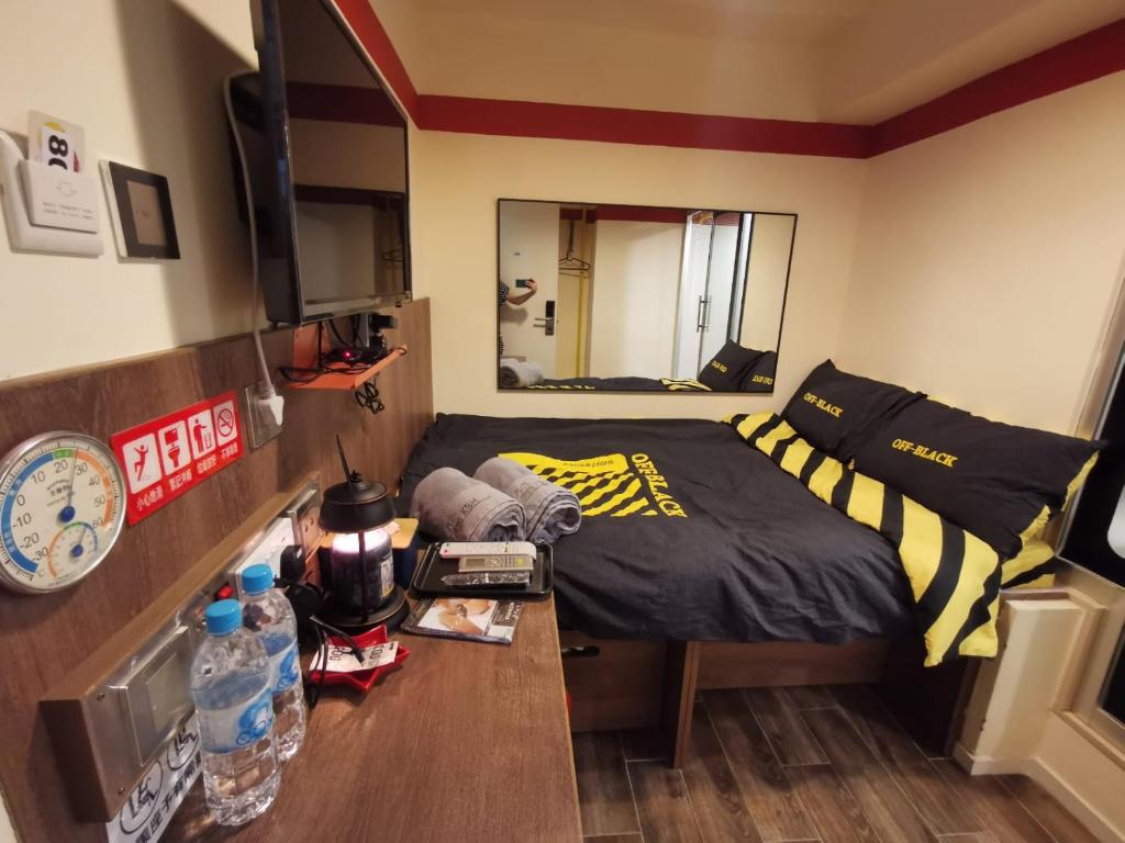 Postel nebo postele na pokoji v ubytování 香港九巴旅馆 KMB-Guesthouse