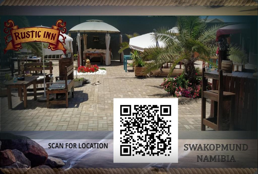 a puzzle of a restaurant with a table and a palm tree at Rustic Inn in Swakopmund