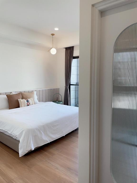 Postel nebo postele na pokoji v ubytování Muzhu B&B
