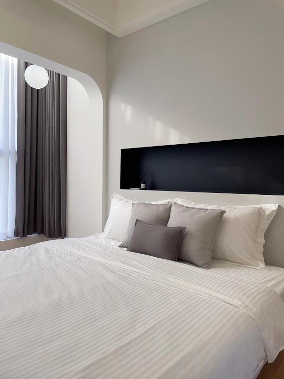 Postel nebo postele na pokoji v ubytování Muzhu B&B