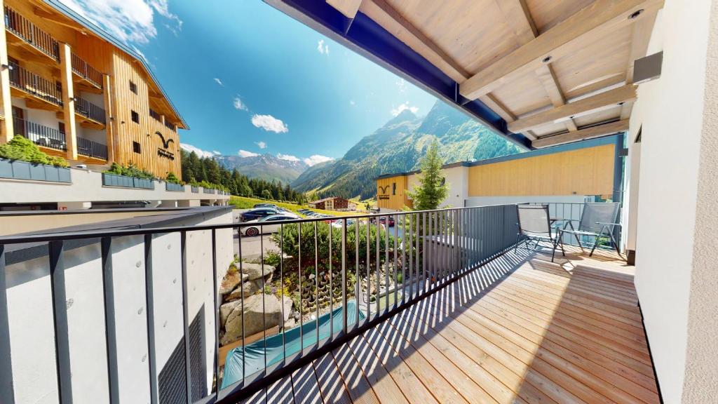 a balcony with a view of a mountain at PitzPlus Appartements in Sankt Leonhard im Pitztal
