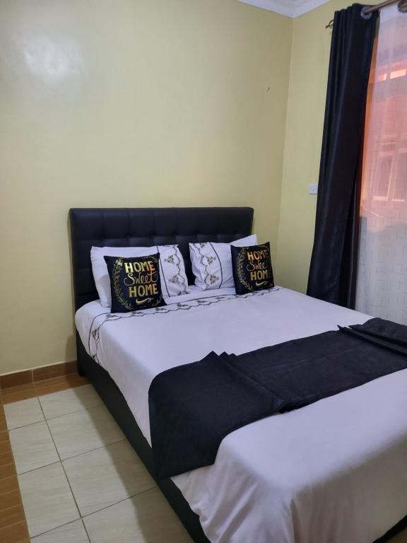 Postel nebo postele na pokoji v ubytování G&G Homes WESTINDIES