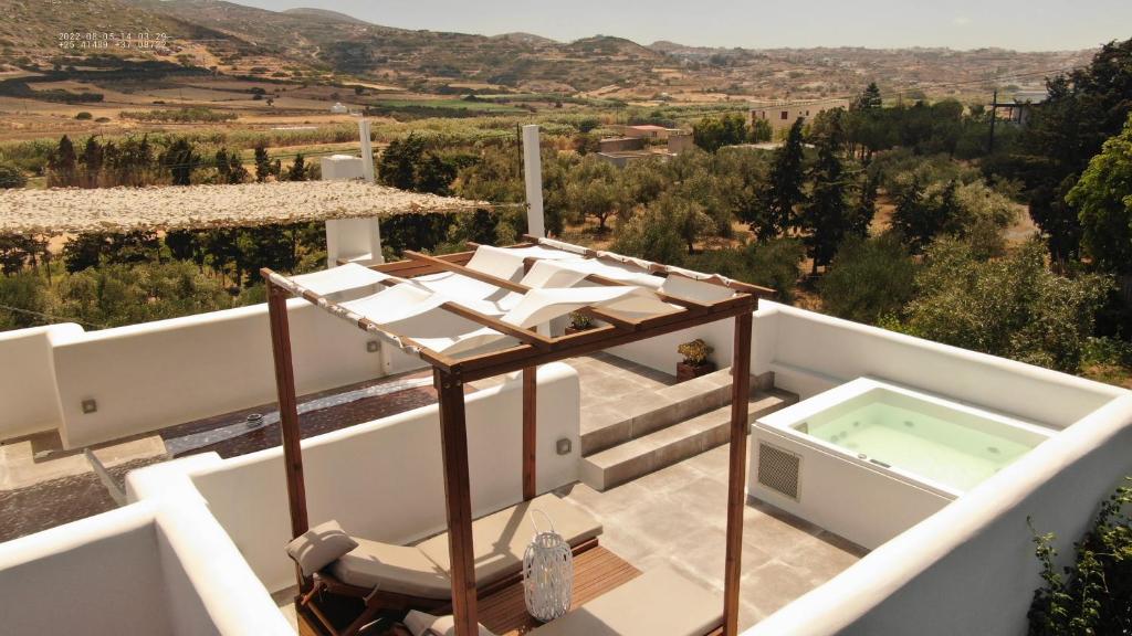 a view from the balcony of a villa with a hot tub at Ninemia Naxos Suites in Naxos Chora