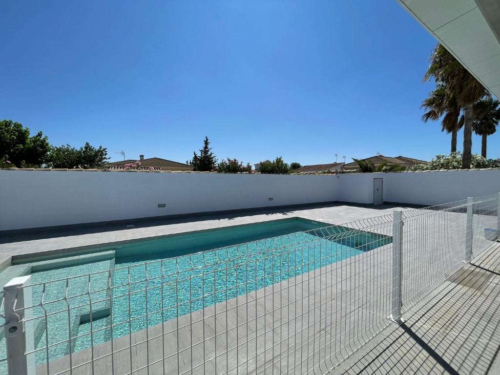 a swimming pool with a fence around it at Casa Miamar II in Campano