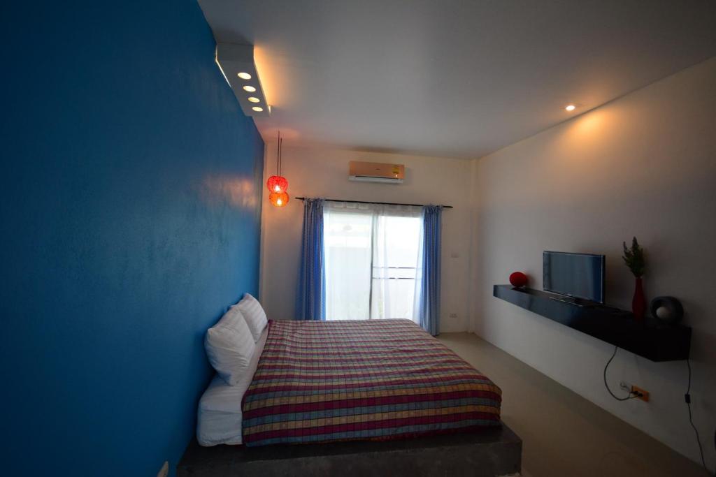 Postel nebo postele na pokoji v ubytování Na-Rak-O Resort