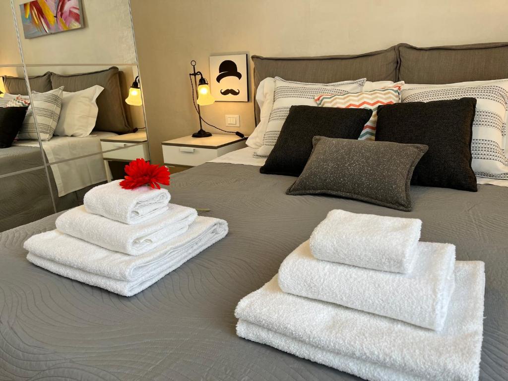 Ένα ή περισσότερα κρεβάτια σε δωμάτιο στο Vele Bianche Cosy Home con terrazza