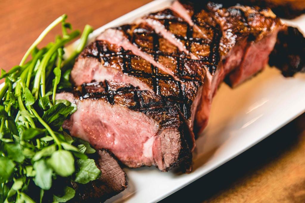 a piece of steak and a salad on a plate at Dhawa Yura Kyoto - Banyan Group in Kyoto