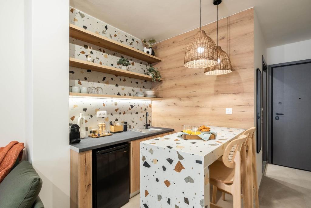 a kitchen with wooden walls and a table in a room at KOYO Athens in Athens