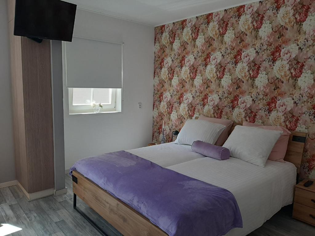Postel nebo postele na pokoji v ubytování b&b de Wensput