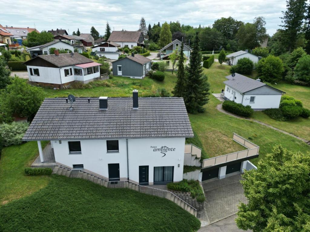 an aerial view of a white house in a suburb at Holiday Home Ambiente by Interhome in Dittishausen