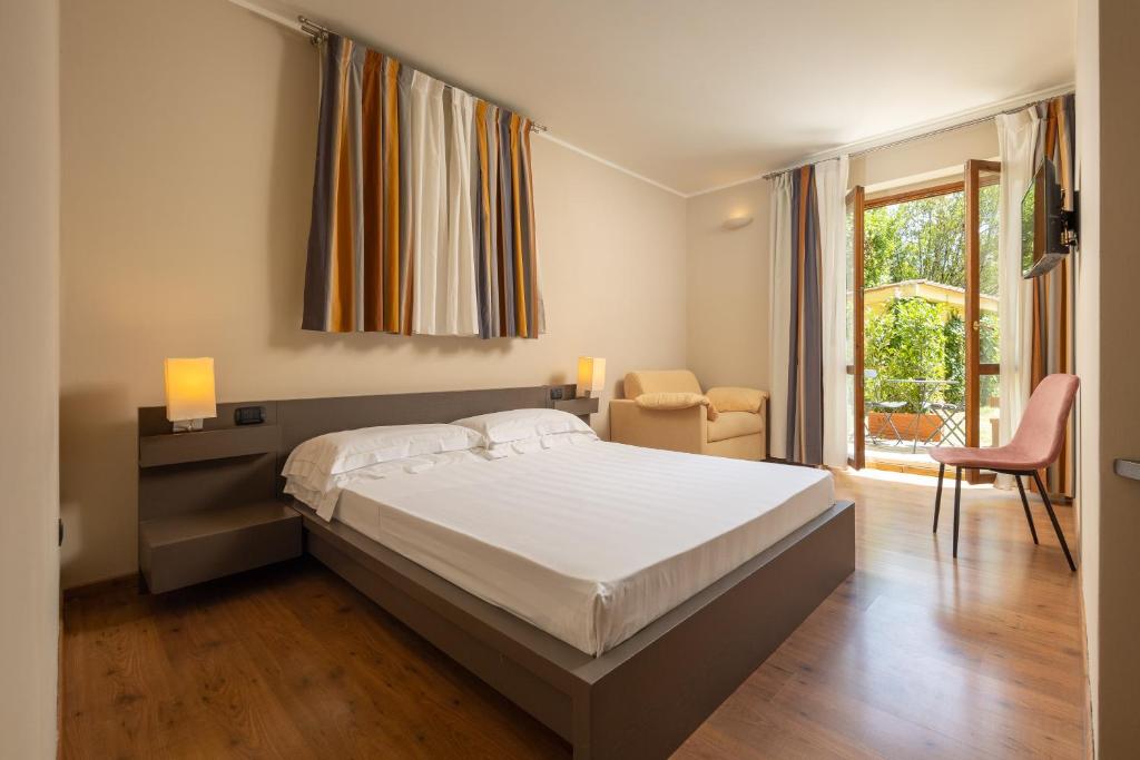 Posteľ alebo postele v izbe v ubytovaní Hotel Villa Betania