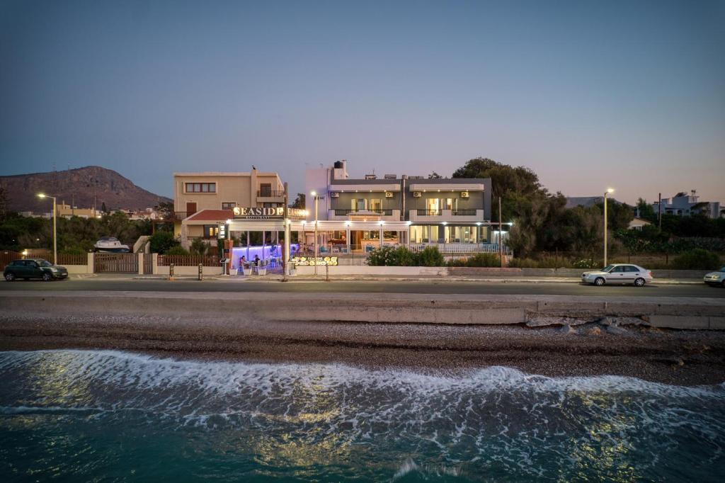 a house on the beach next to a body of water at Seaside Gouves by Estia in Kato Gouves