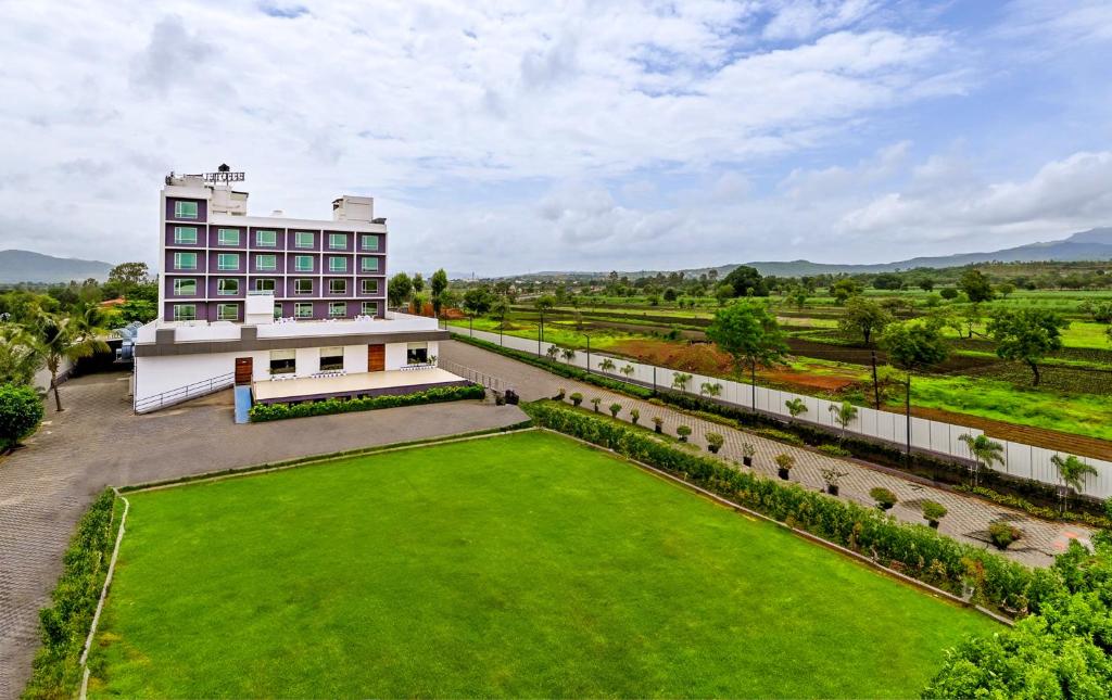 an aerial view of a building and a large lawn at Effotel by Sayaji Sarola in Bhor