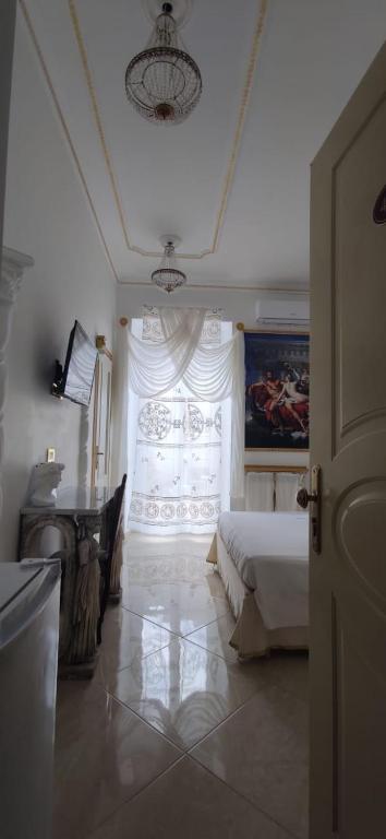 Postel nebo postele na pokoji v ubytování B&B IL TEMPIO