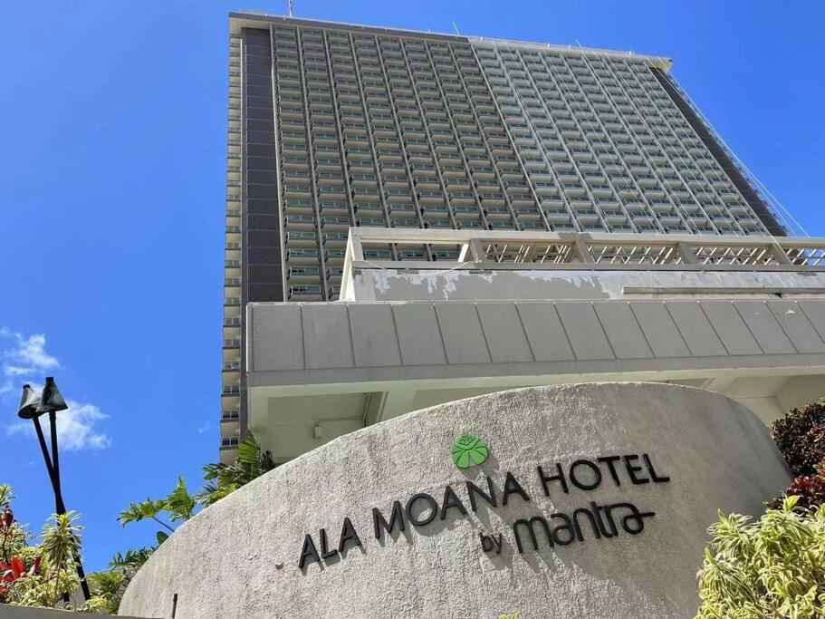 a building with a miami hotel sign in front of it at ~Four-star serviced apartment in Honolulu