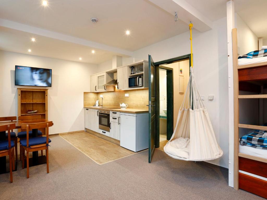 a room with a kitchen and a dining room at Studio Vodopády Černá Desná by Interhome in Desná