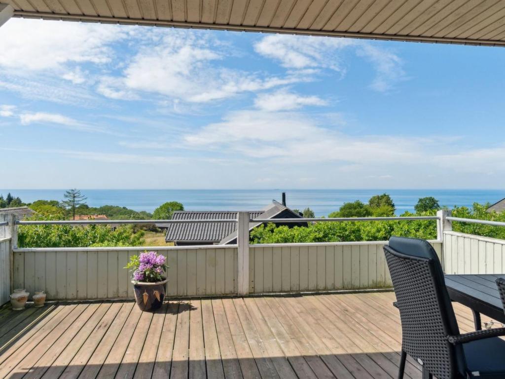 une terrasse avec vue sur l'océan depuis une maison dans l'établissement Holiday Home Eliene - 400m from the sea in Bornholm by Interhome, à Hasle