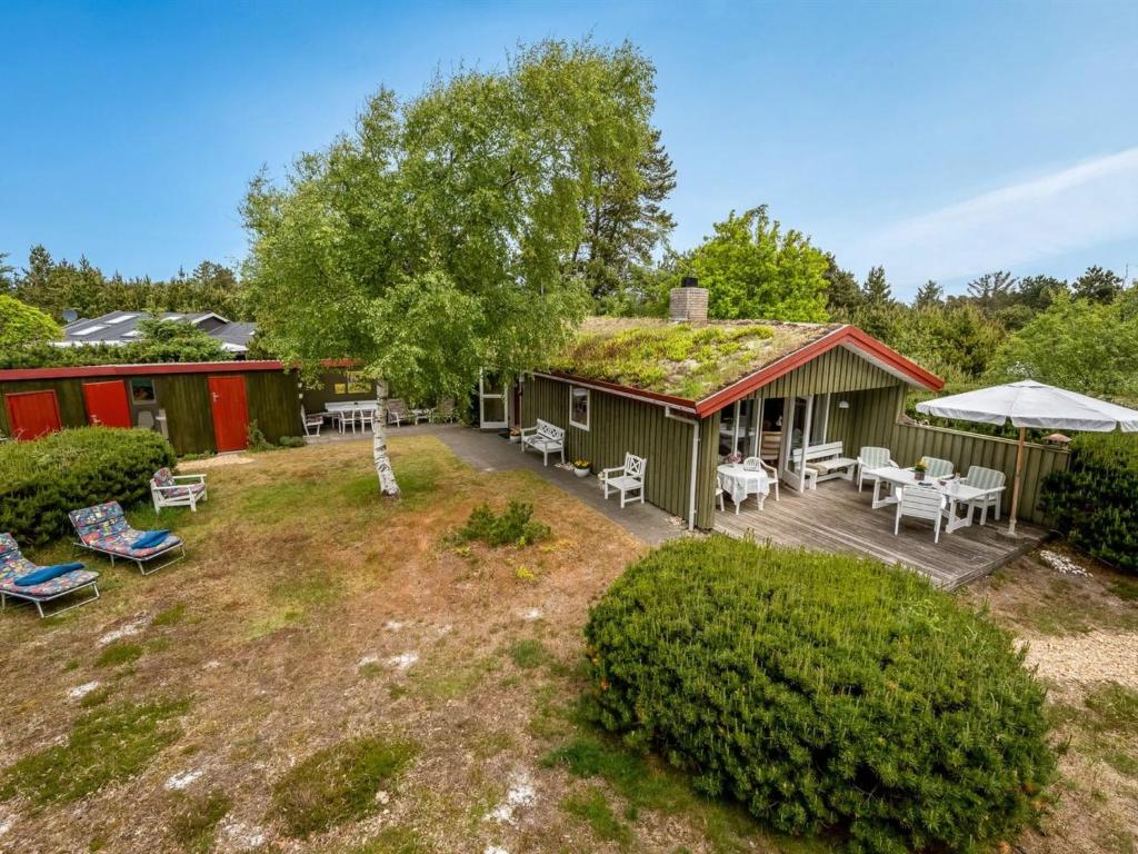 an aerial view of a house with a grass roof at Holiday Home Sisko - 800m from the sea in Western Jutland by Interhome in Vejers Strand