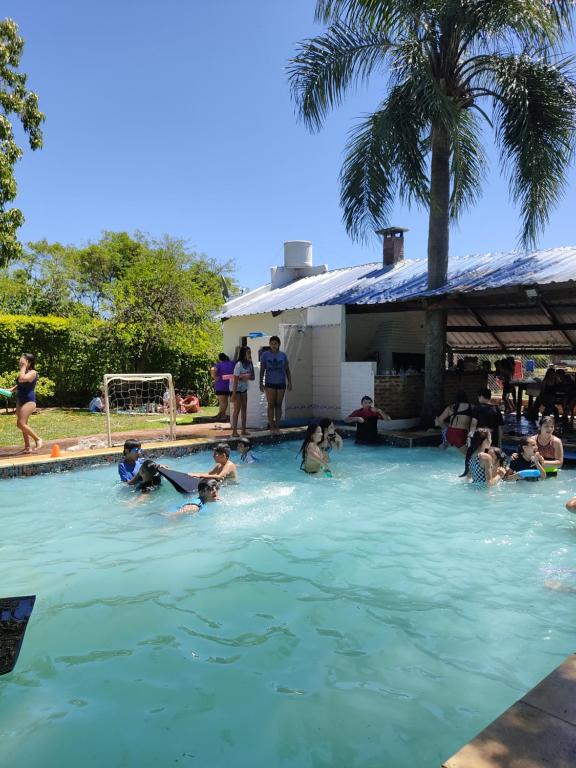 a group of people playing in a swimming pool at CASA DE TECHO AZUL in Resistencia