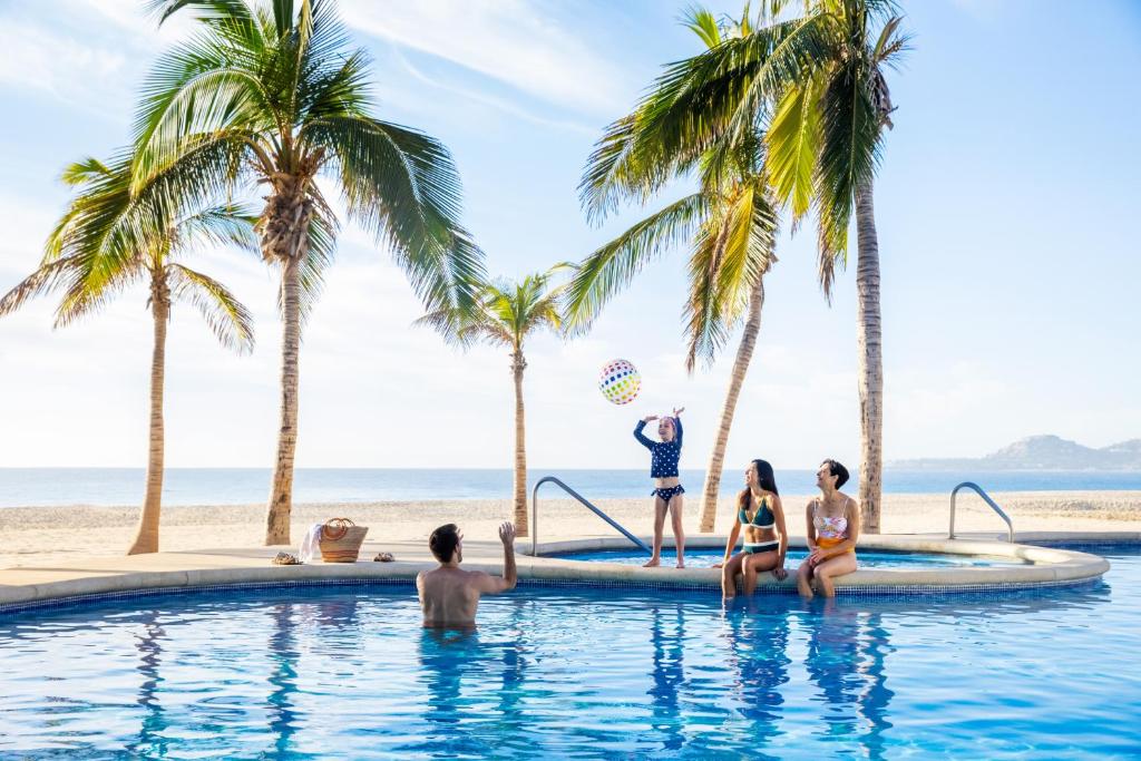 a group of people in the pool at the beach at Hyatt Ziva Los Cabos - All Inclusive in San José del Cabo