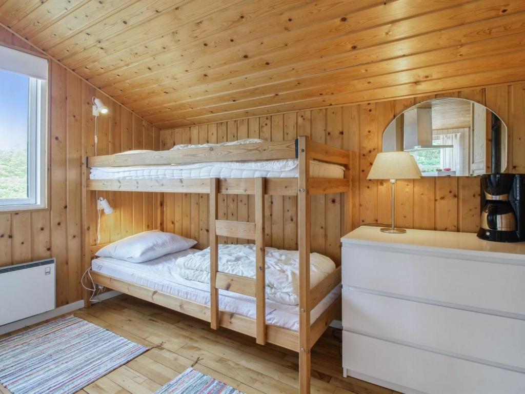 Postel nebo postele na pokoji v ubytování Holiday Home Frellef - 491m from the sea by Interhome
