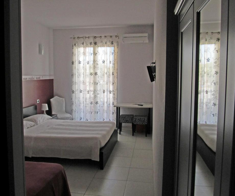 Postel nebo postele na pokoji v ubytování B&B Persi Nel Sud, Pozzallo