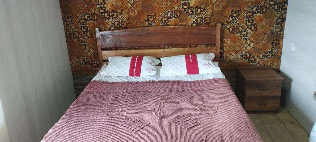 Postel nebo postele na pokoji v ubytování Guesthouse Omalo
