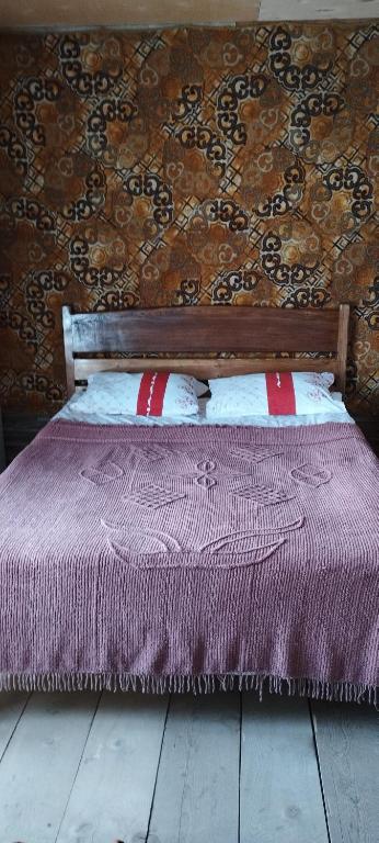 Postel nebo postele na pokoji v ubytování Guesthouse Omalo