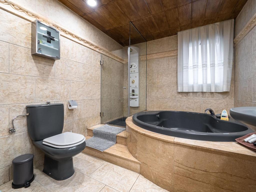 Koupelna v ubytování Villa Villa Luxury Rock Tirri by Interhome