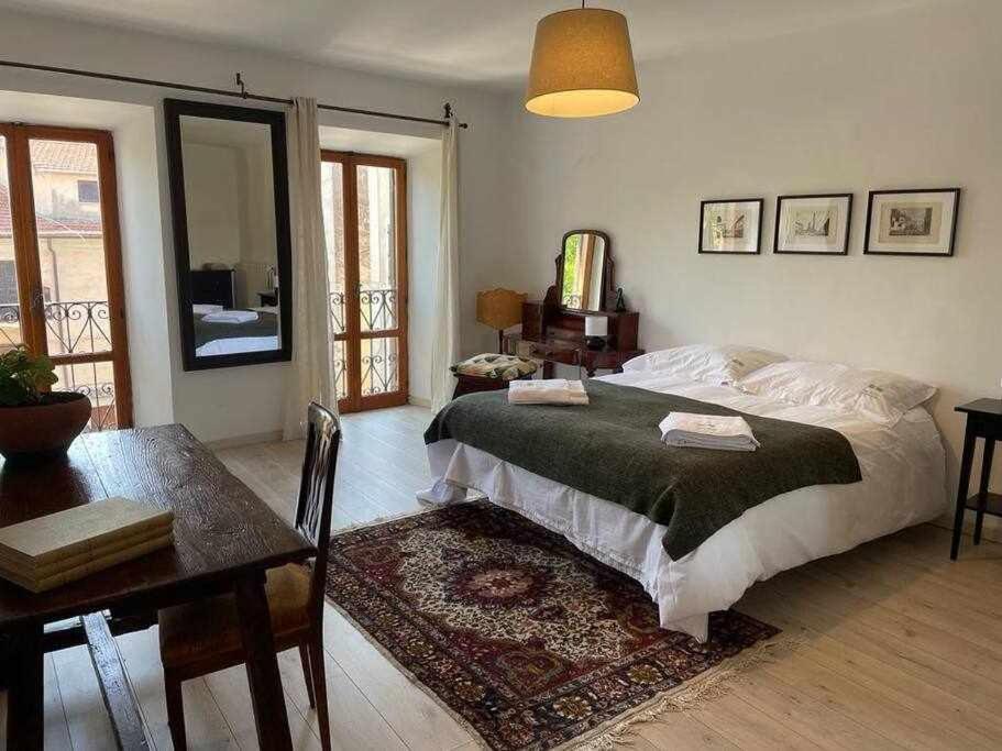 מיטה או מיטות בחדר ב-Libellula Casa Vacanze