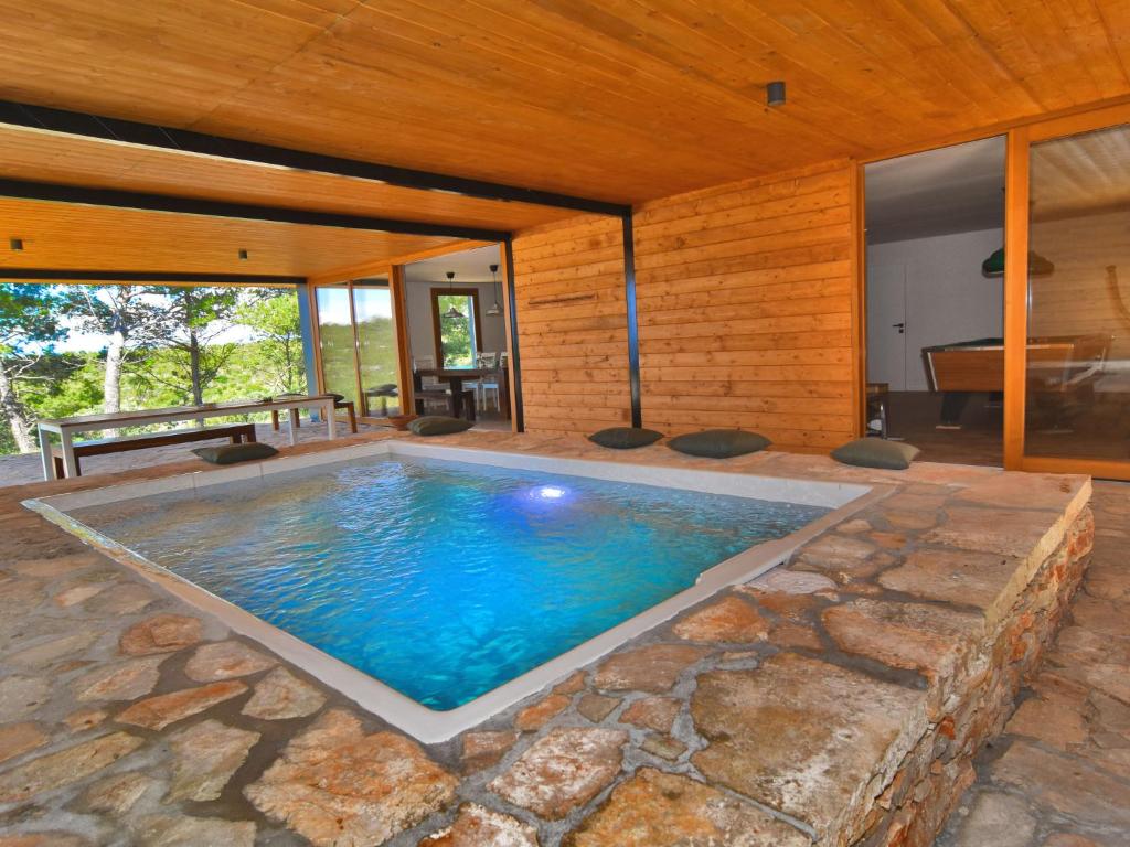 an indoor swimming pool in a house at Holiday Home Villa Baraka by Interhome in Božava