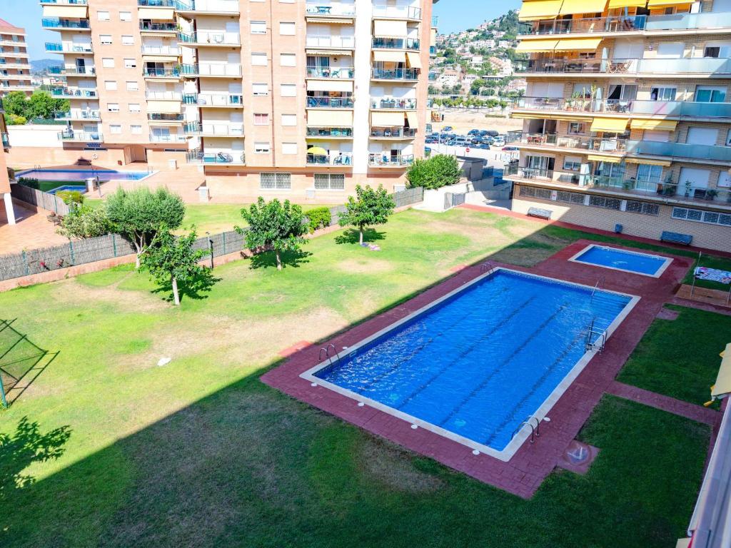 an overhead view of a large swimming pool in a yard at Apartment Colom by Interhome in Malgrat de Mar